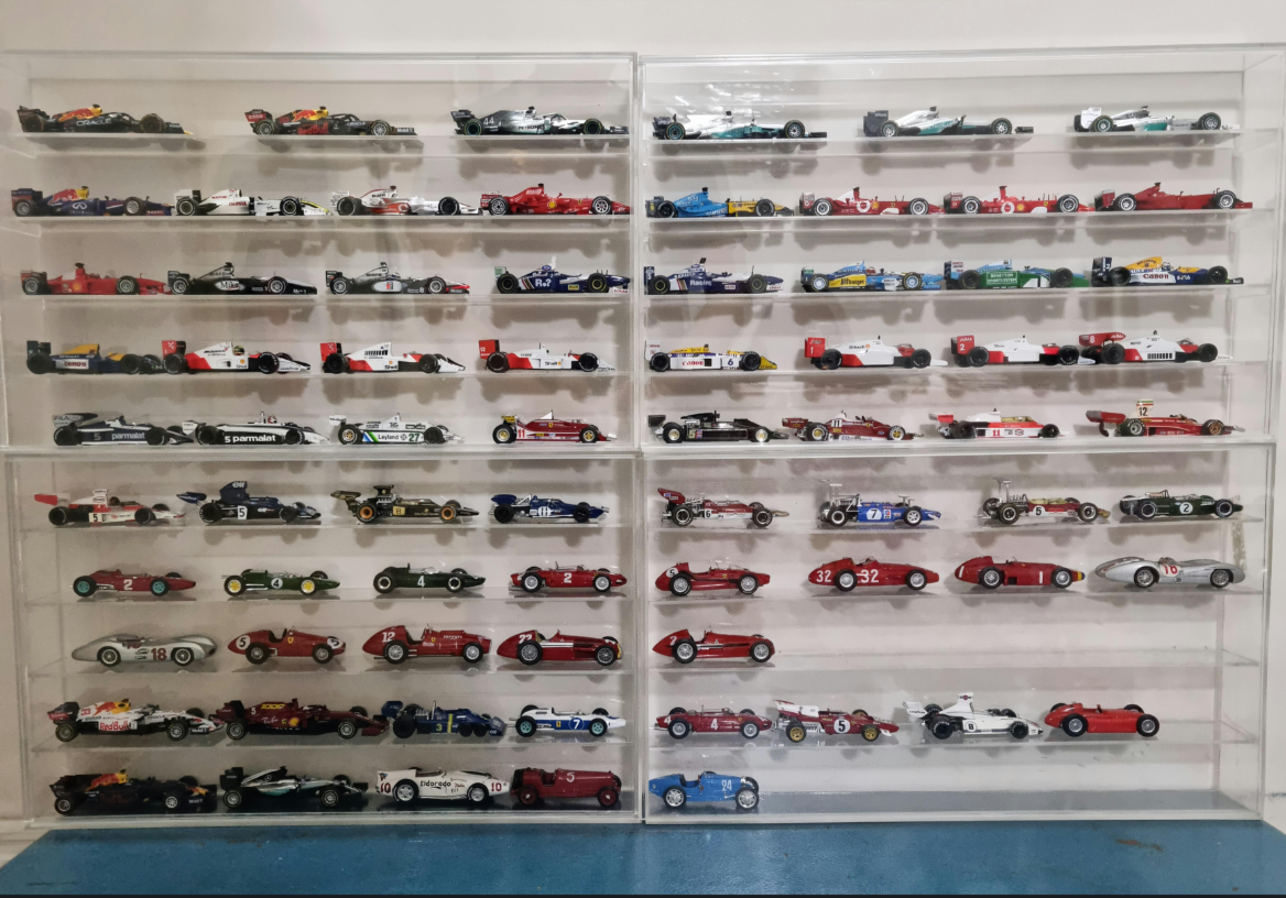 Scale models of legendary cars lined up.